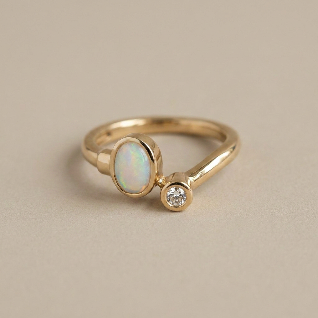 14k yellow gold Toi-et-Moi ring with oval opal and round diamond asymmetrical setting