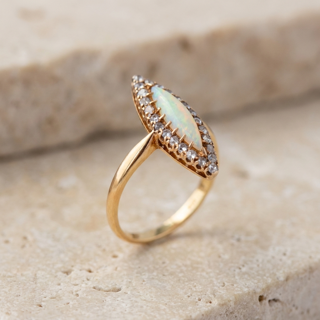Side view of open-backed Edwardian opal ring in 585 yellow gold