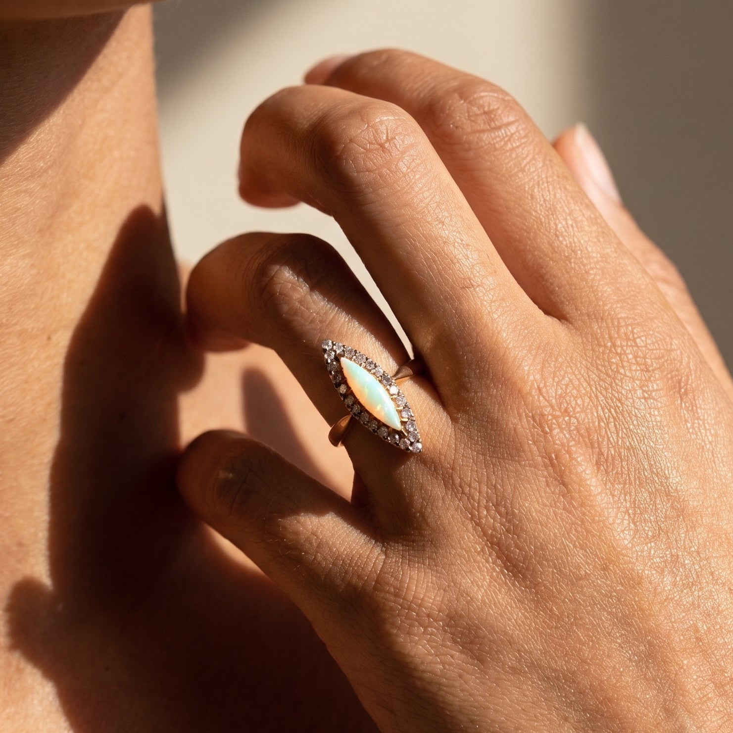 Antique 14k gold opal ring worn on finger showing scale and fit