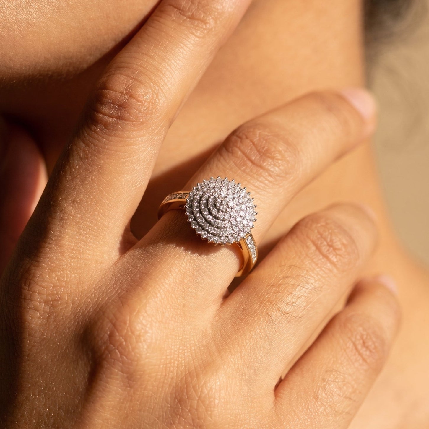 Model wearing 14k yellow gold diamond cluster ring showing fit and sparkle on hand