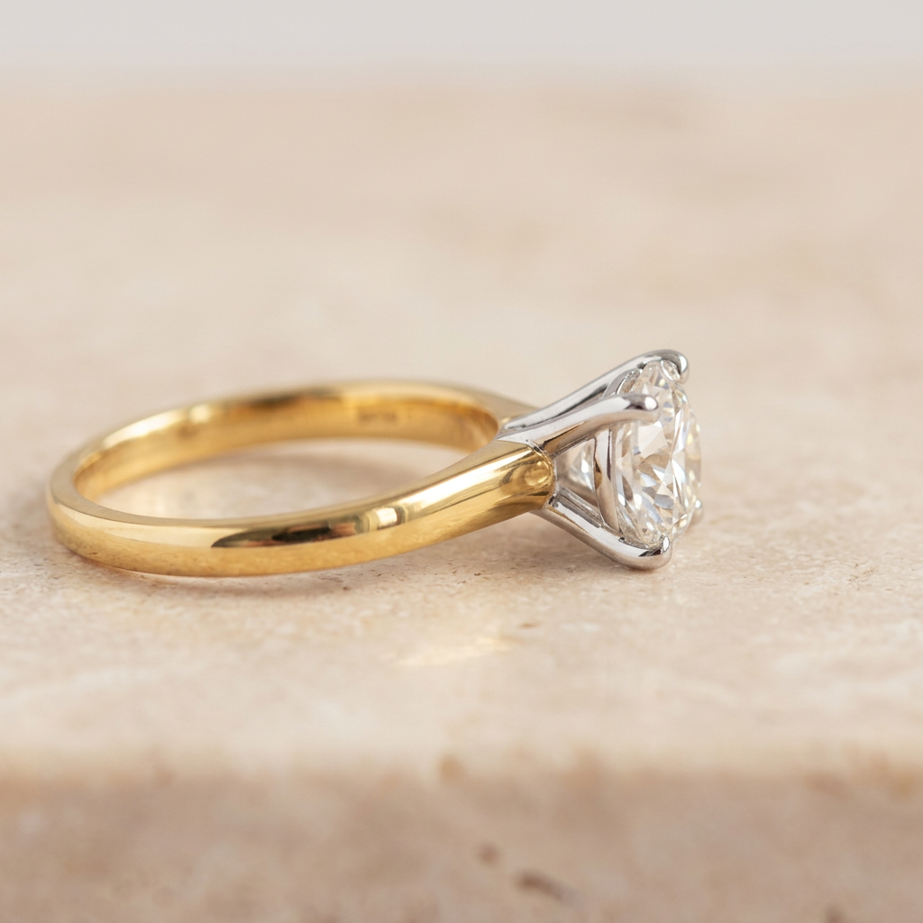 Side profile of 14k yellow gold ring showing secure white gold diamond prongs