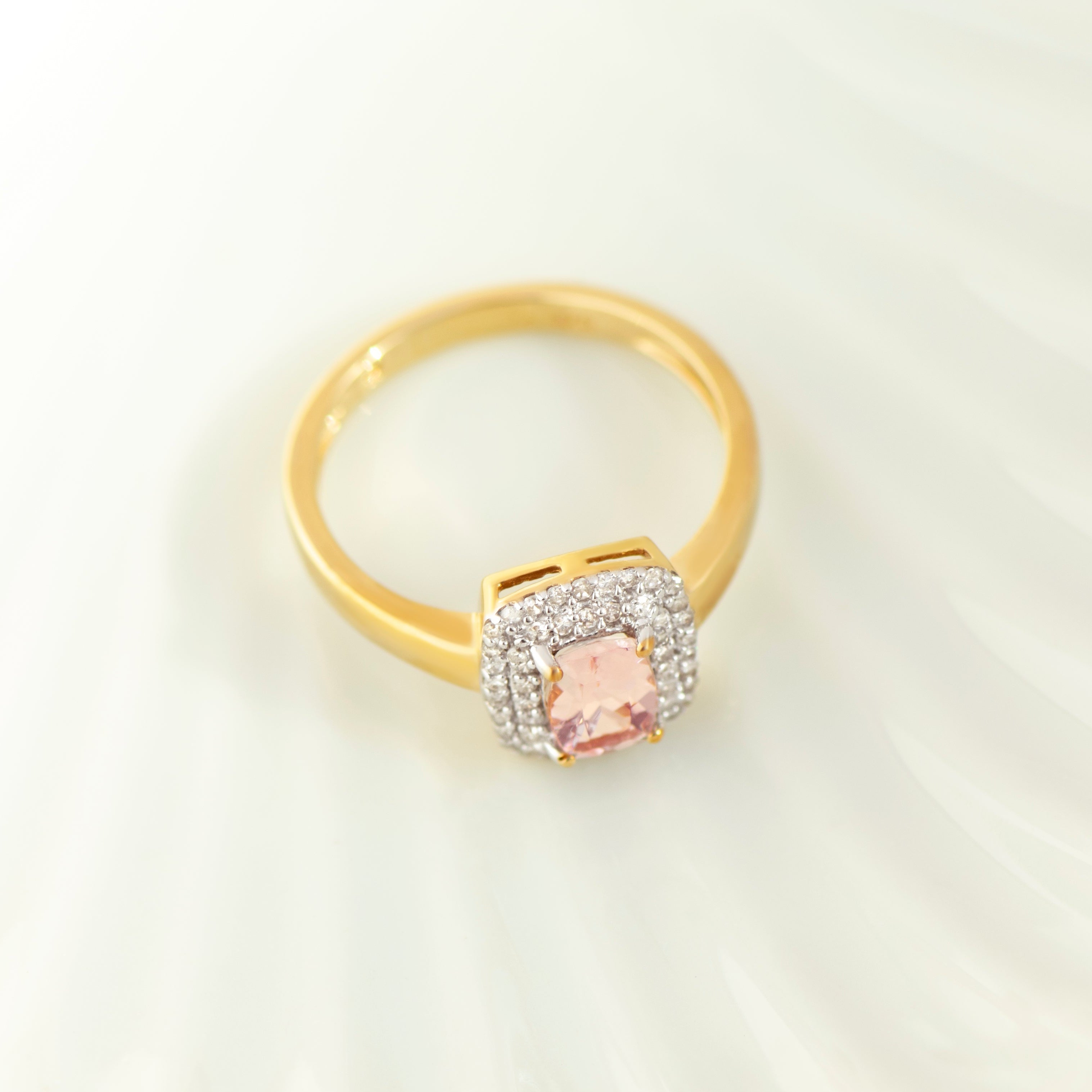 Top view of rectangular Kunzite ring in yellow gold
