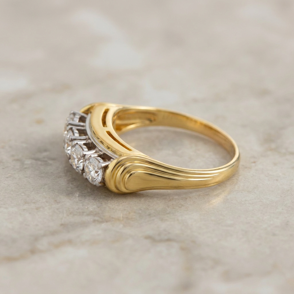 18k yellow gold ring with four brilliant diamonds on sculpted shoulders